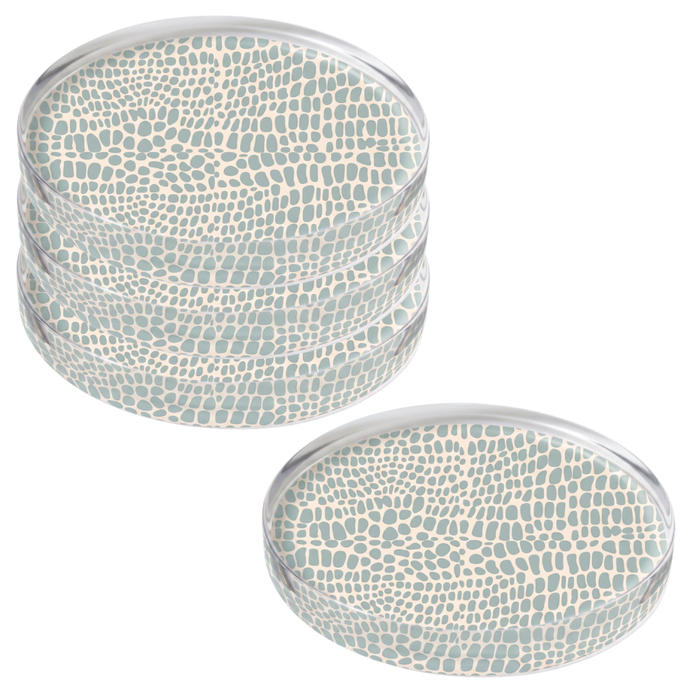 Four round acrylic coasters with Pebble Blue pattern on a white background